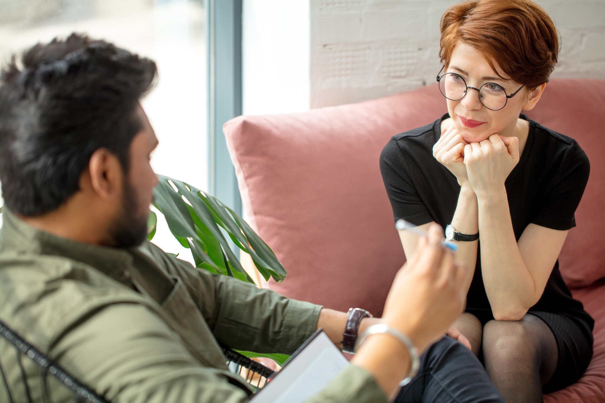 a man and woman sitting on a couch